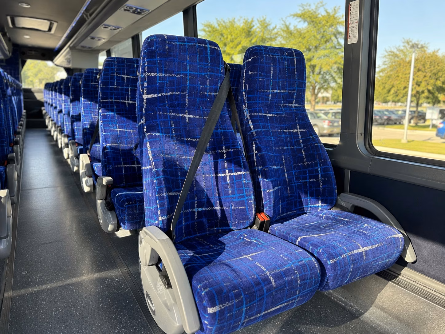 sporting event bus rentals for michigan area college games and high school athletics
